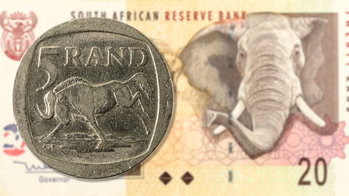 An image of a five South African rand palced over a 20 rand note.